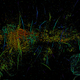 A multi-colored image shows long vertical streaks of magnetic filaments in the Milky Way's core.
